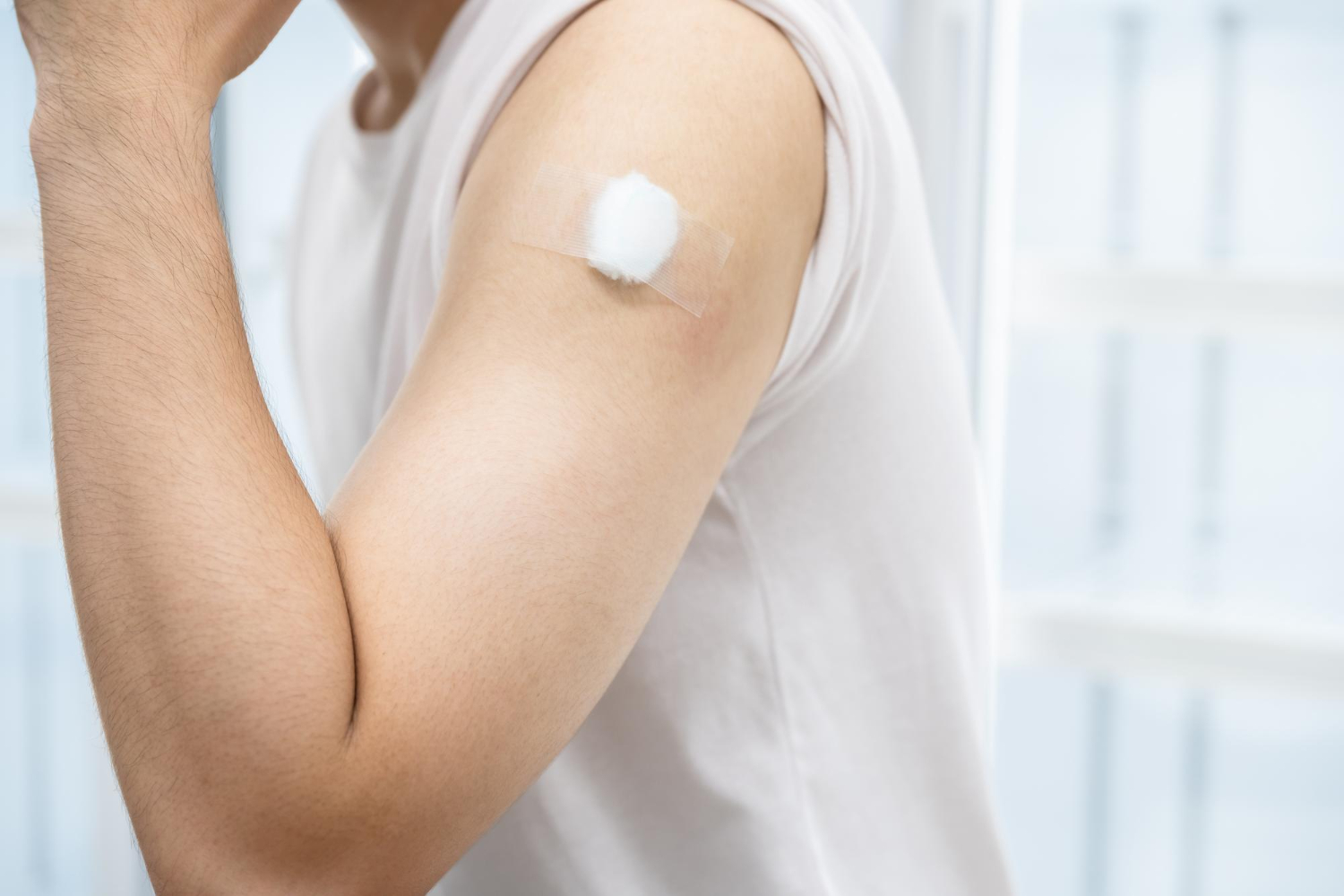 bandage on man's arm where he was vaccinated myths about immunization arnot health